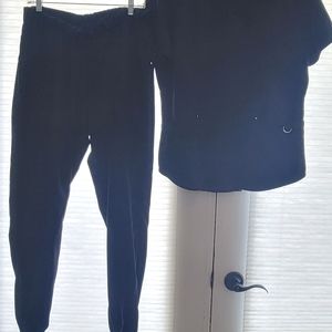 2 sets of scrubs. Soft and like new. L/XL, black and navy blue